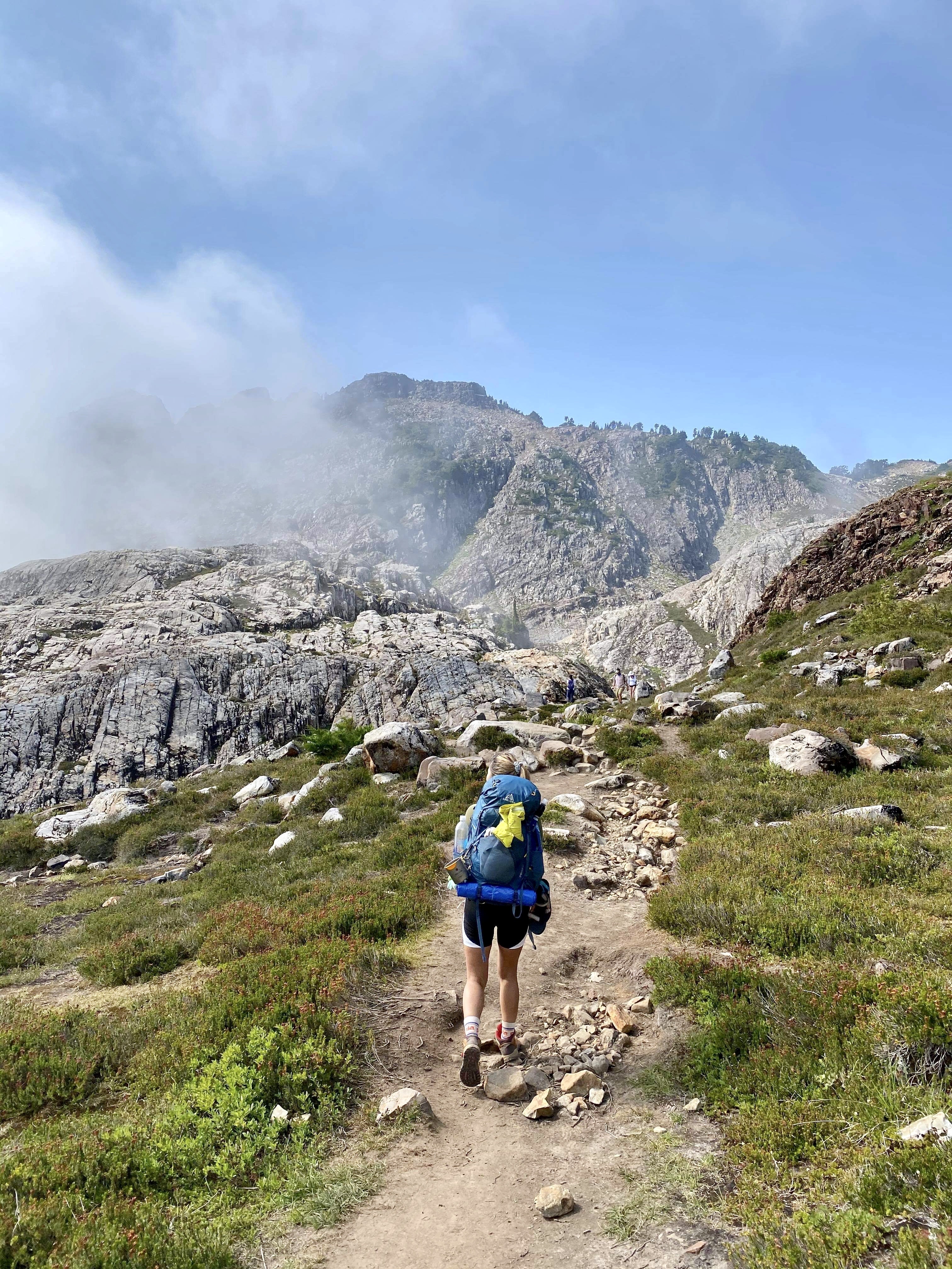 backpacker hiking up Gothic Basin