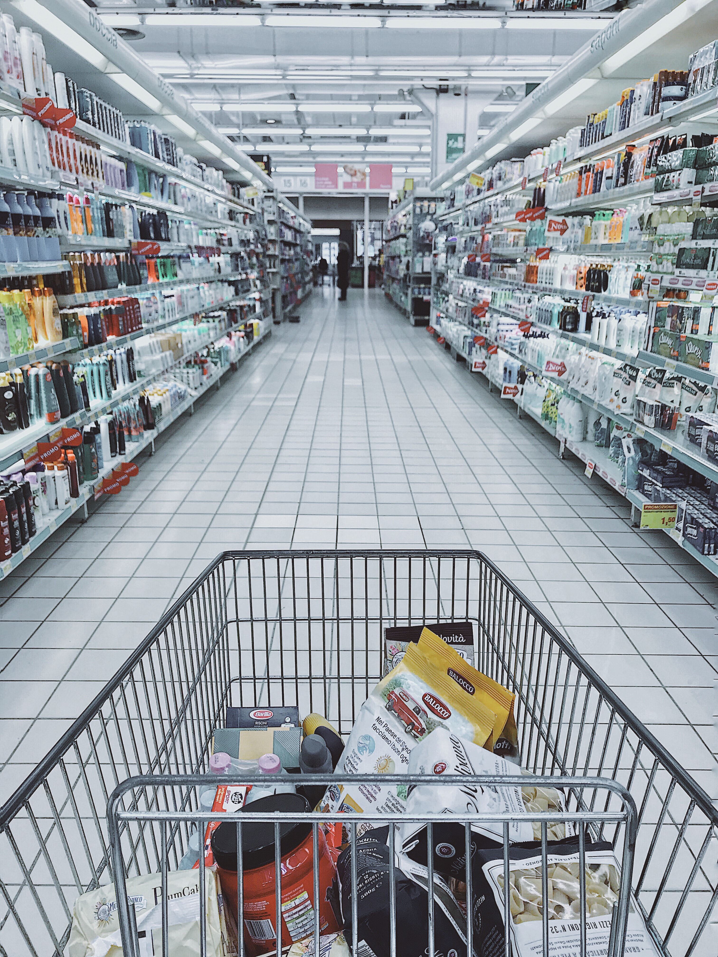 shopping cart in grocery aisle